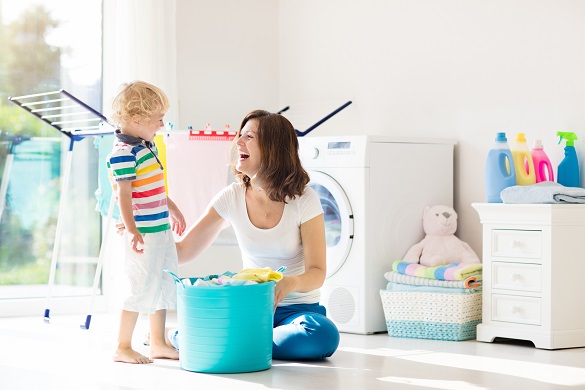 Mother and child doing laundry